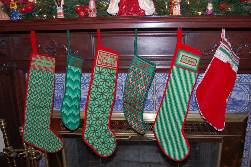 Lori has handmade needlepoint stockings that are hung with care. 